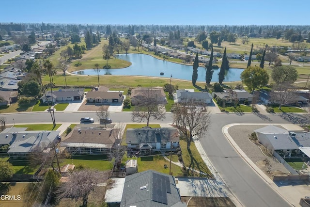 drone / aerial view with a residential view and a water view