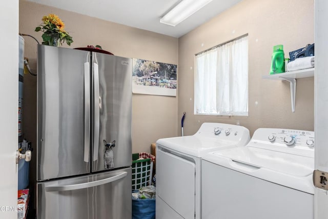 laundry room with laundry area and washer and clothes dryer