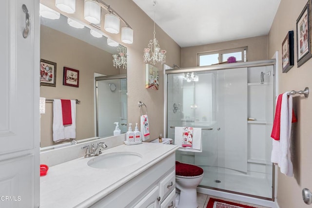 full bath featuring vanity, a shower stall, toilet, and tile patterned floors