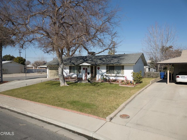 view of front of home with a garage, a carport, concrete driveway, and a front lawn