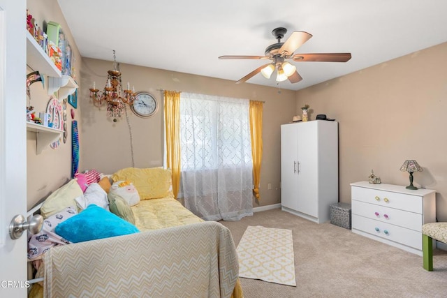 carpeted bedroom with a ceiling fan