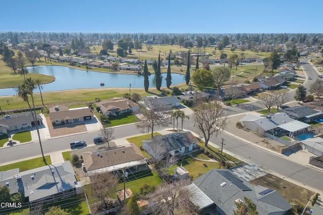 drone / aerial view featuring a residential view and a water view