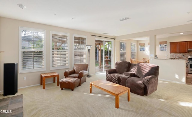 living room featuring light carpet