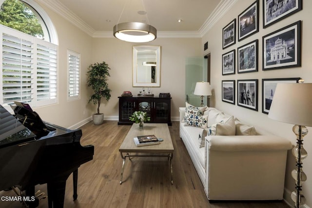 living area with ornamental molding and hardwood / wood-style floors