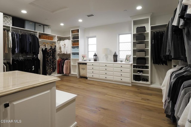 spacious closet featuring light wood-type flooring