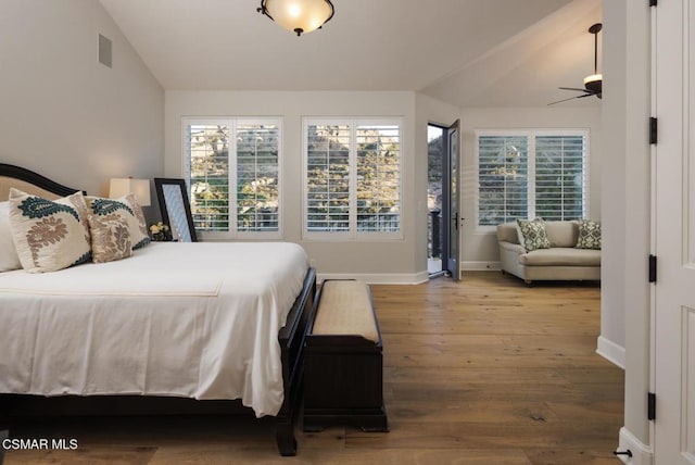 bedroom with lofted ceiling and hardwood / wood-style floors