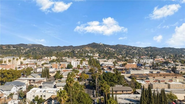 property's view of city with a mountain view