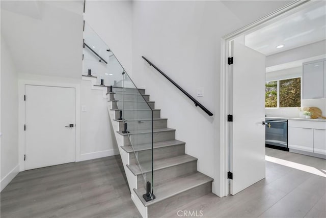 stairway with wood finished floors