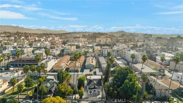 birds eye view of property with a mountain view