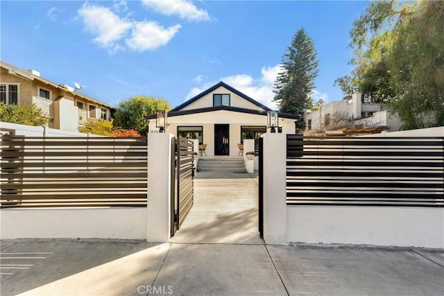 view of gate featuring a fenced front yard