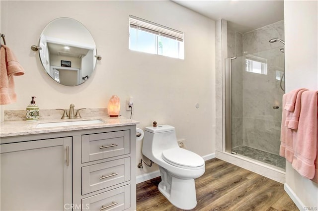 bathroom featuring wood-type flooring, toilet, and walk in shower