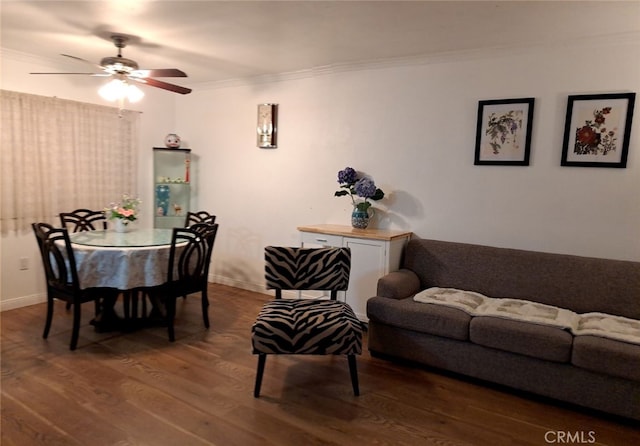 living room featuring ceiling fan, ornamental molding, and hardwood / wood-style floors