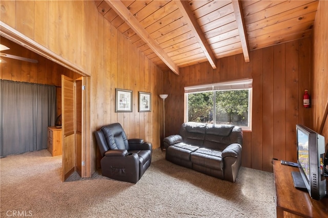 living room featuring carpet flooring, vaulted ceiling with beams, wooden ceiling, and wooden walls