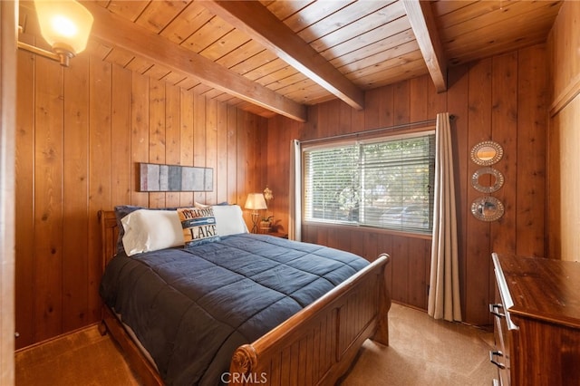 bedroom with beamed ceiling, wooden ceiling, light carpet, and wood walls