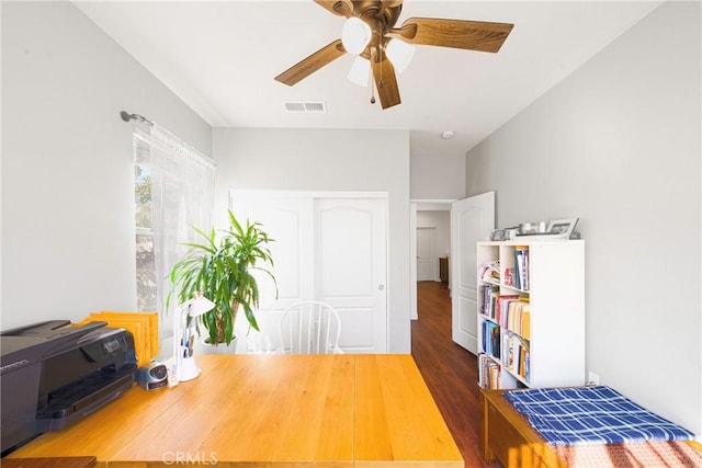 office with dark hardwood / wood-style floors and ceiling fan