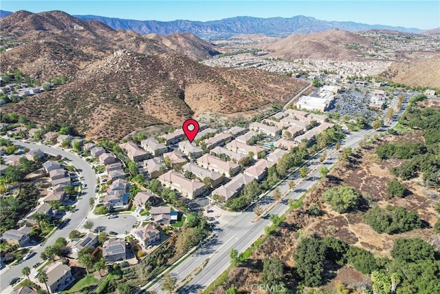 birds eye view of property featuring a mountain view