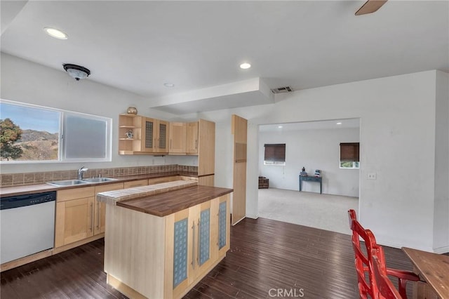 kitchen with sink, light brown cabinets, plenty of natural light, dark hardwood / wood-style floors, and dishwasher