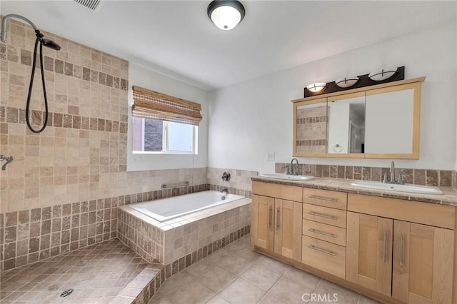 bathroom featuring vanity, shower with separate bathtub, and tile patterned flooring