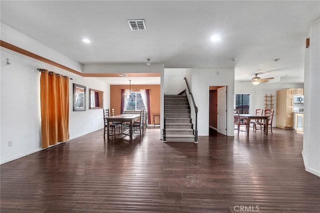 interior space with dark hardwood / wood-style floors and ceiling fan