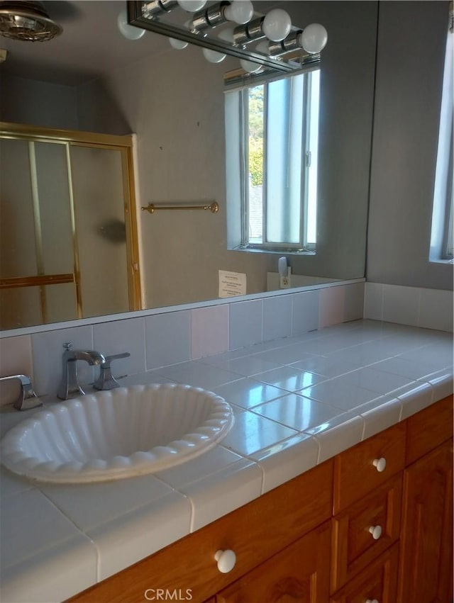 bathroom with sink and walk in shower