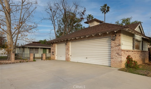 view of side of home with a garage