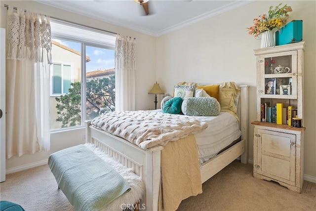 bedroom featuring crown molding and carpet