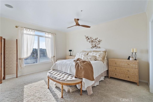 bedroom featuring ceiling fan and light colored carpet