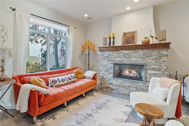 sitting room with a fireplace and recessed lighting