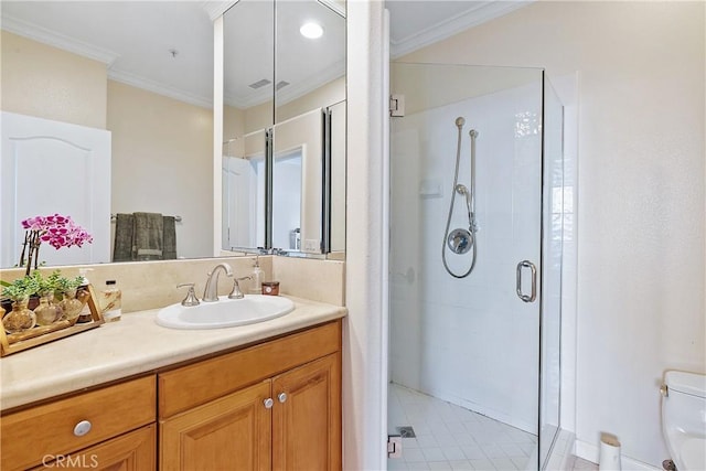 full bath featuring a stall shower, crown molding, vanity, and toilet