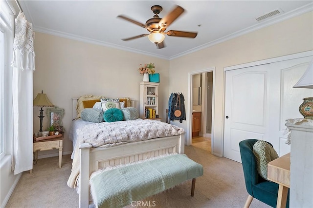 bedroom with light carpet, visible vents, and crown molding