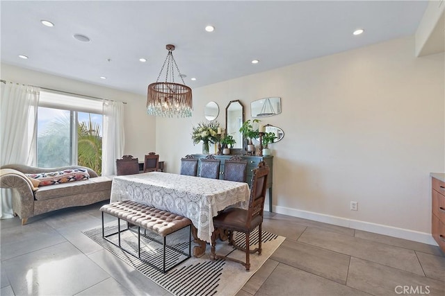 dining space featuring a chandelier, light tile patterned floors, recessed lighting, and baseboards