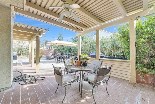 view of patio / terrace featuring ceiling fan and a bar