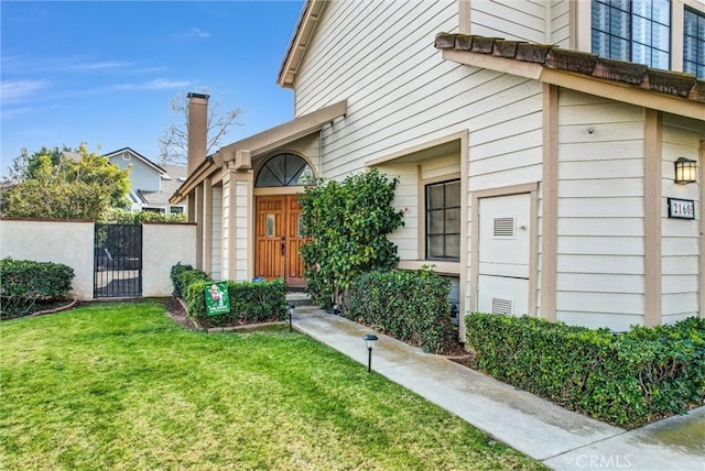 property entrance with a yard