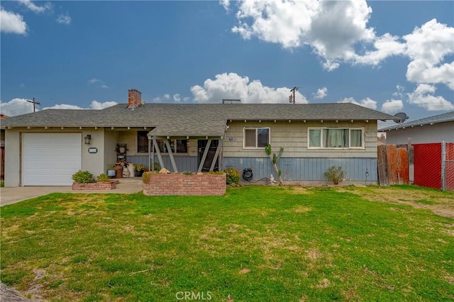 ranch-style house with a garage and a front lawn