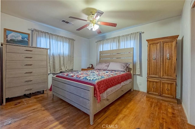 bedroom with ceiling fan and light wood-type flooring