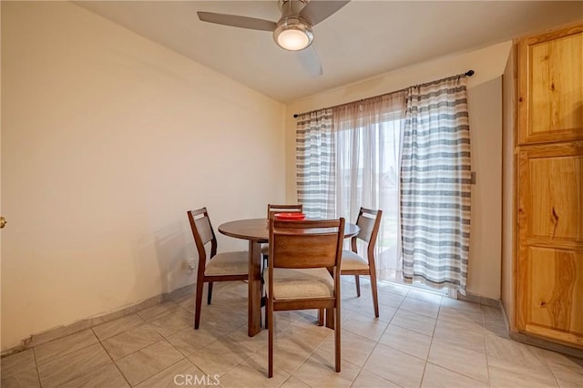 dining room featuring light tile patterned flooring and ceiling fan