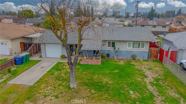 view of front of house featuring a garage and a front yard