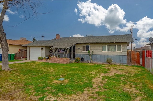 single story home with a garage and a front yard