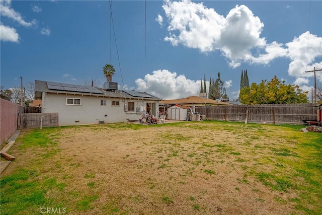 view of yard with a shed and central AC