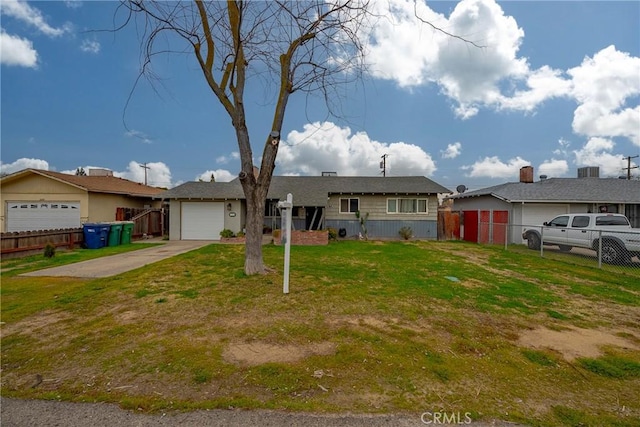 ranch-style home featuring a garage and a front lawn