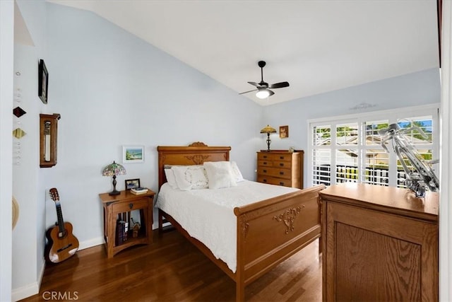 bedroom featuring lofted ceiling, dark hardwood / wood-style floors, and ceiling fan