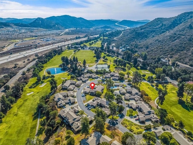 birds eye view of property featuring a water and mountain view