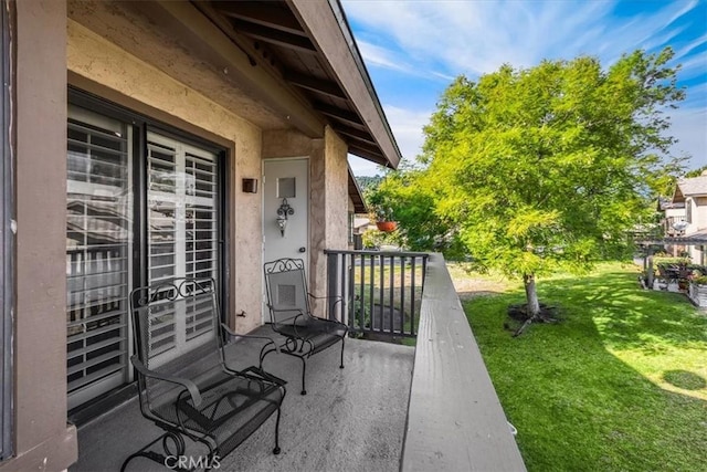 view of patio / terrace with a balcony