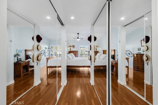 bedroom with recessed lighting, baseboards, and wood finished floors