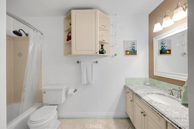 full bathroom with toilet, shower / bath combo with shower curtain, vanity, baseboards, and tile patterned floors