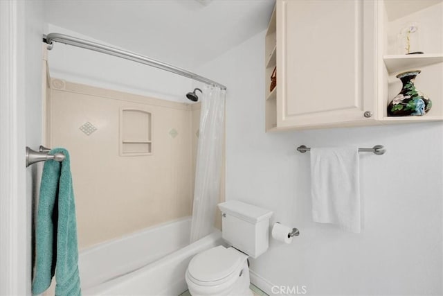 bathroom with shower / bath combo with shower curtain and toilet