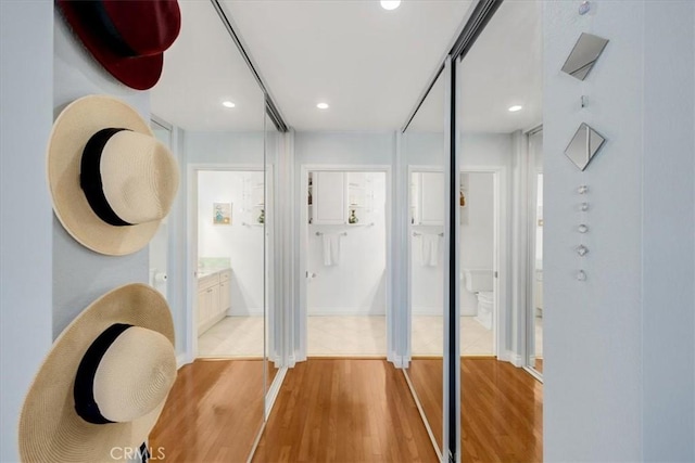 interior space with light wood-style floors and recessed lighting