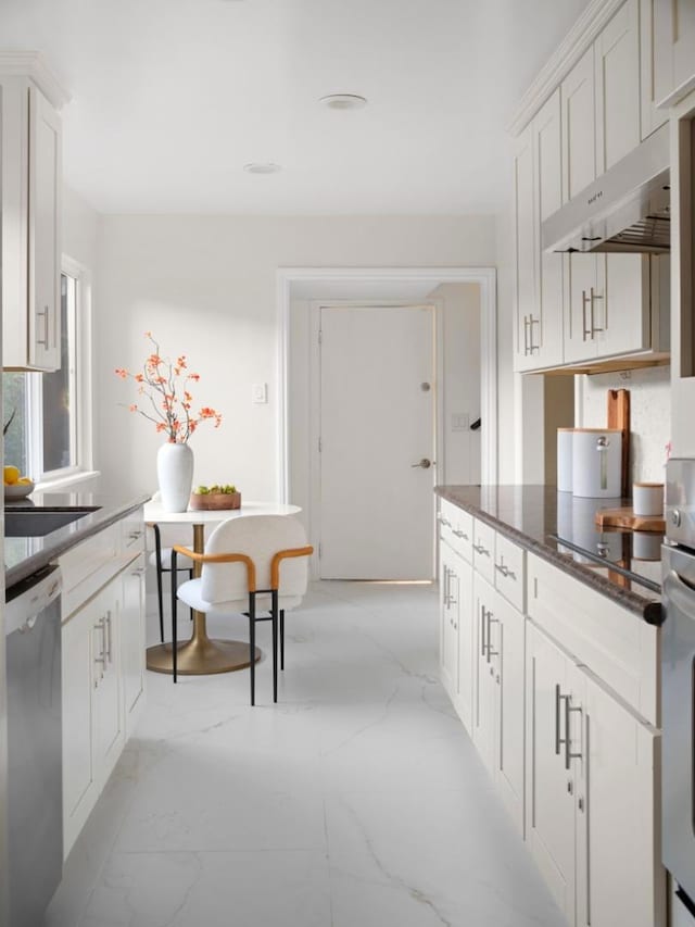 kitchen featuring sink, stainless steel dishwasher, white cabinets, and black electric cooktop