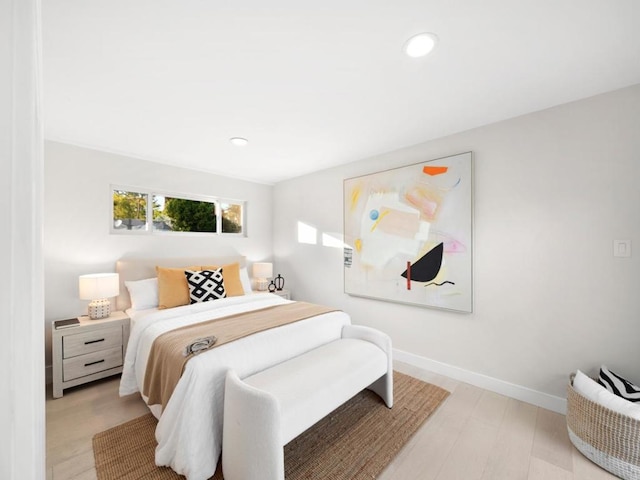 bedroom with light wood-type flooring