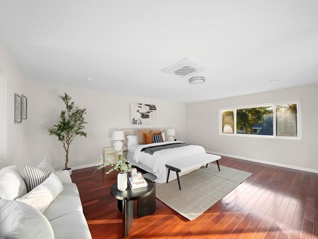 bedroom with dark wood-type flooring